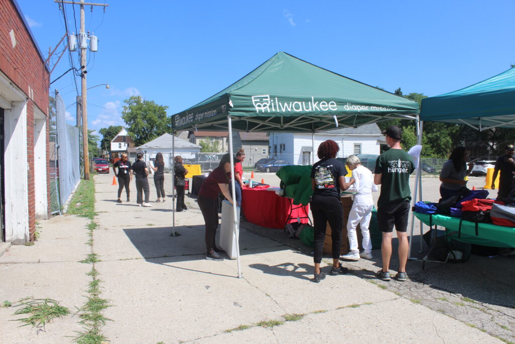 A tent at a Amani United distribution event.